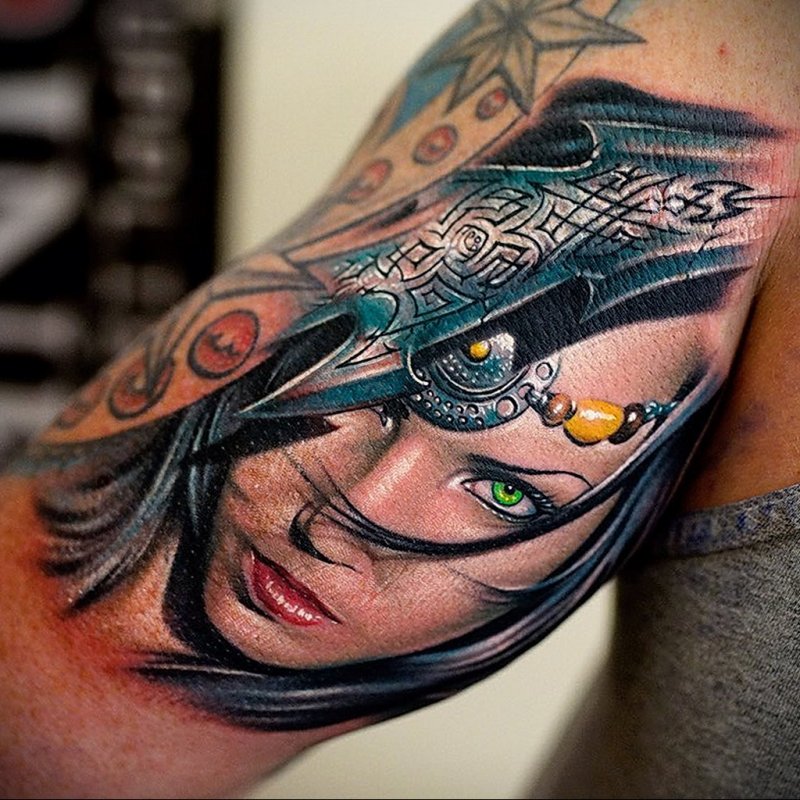 Colorful fantasy style tattoo on the shoulder for men