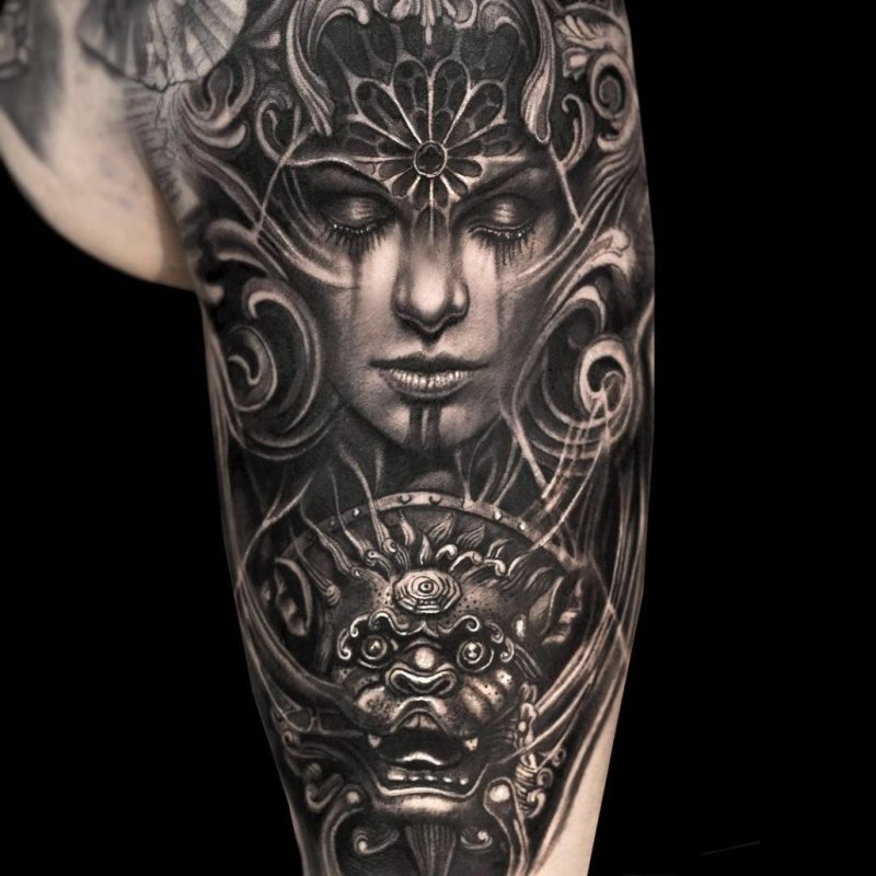 Fantasy style tattoo on the shoulder for men