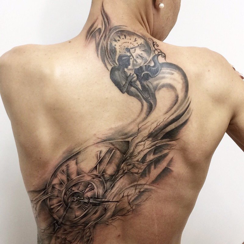 Fantasy style tattoo on the back for women