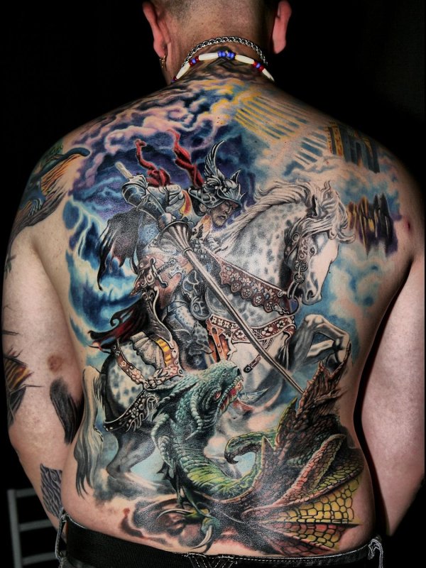 Colorful fantasy style tattoo on the back for men