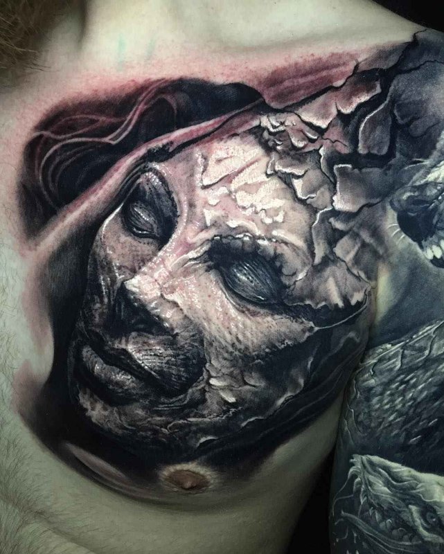 Fantasy style tattoo on chest for men