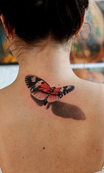 Realism style butterfly color tattoo on the back of the head for women