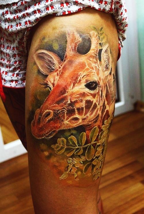 Realism style giraffe tattoo on thigh for women