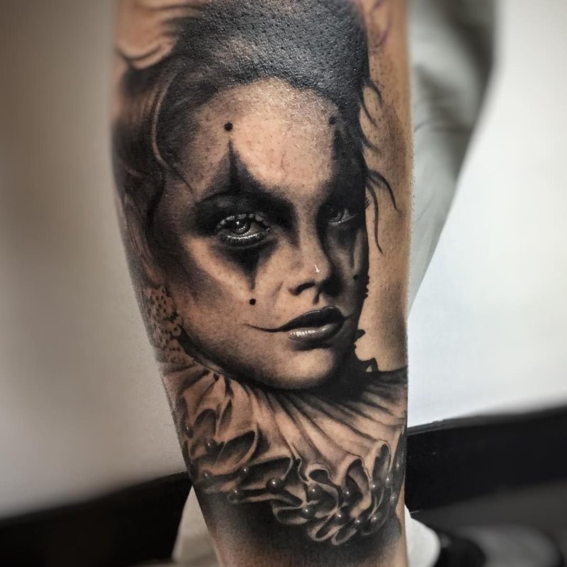 Realism style tattoo on the shin for women