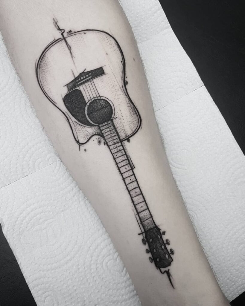 Guitar tattoo on the arm for men