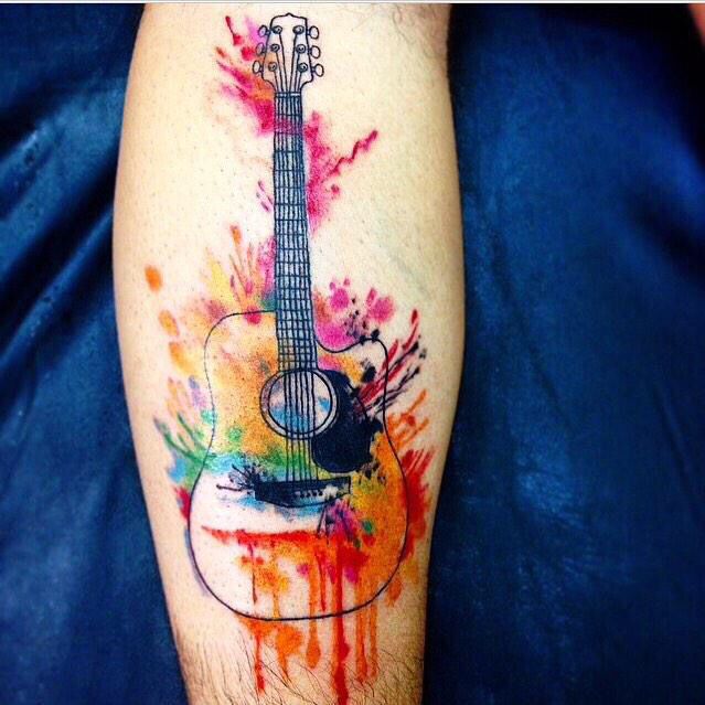 Colorful guitar tattoo on forearm for men