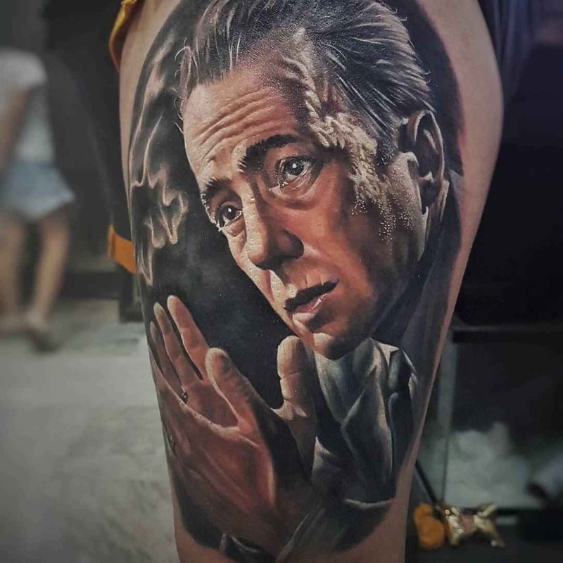 Realism style tattoo on the thigh for men