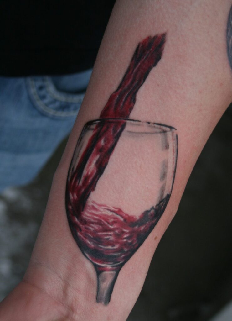 Colorful wine tattoo on forearm for men