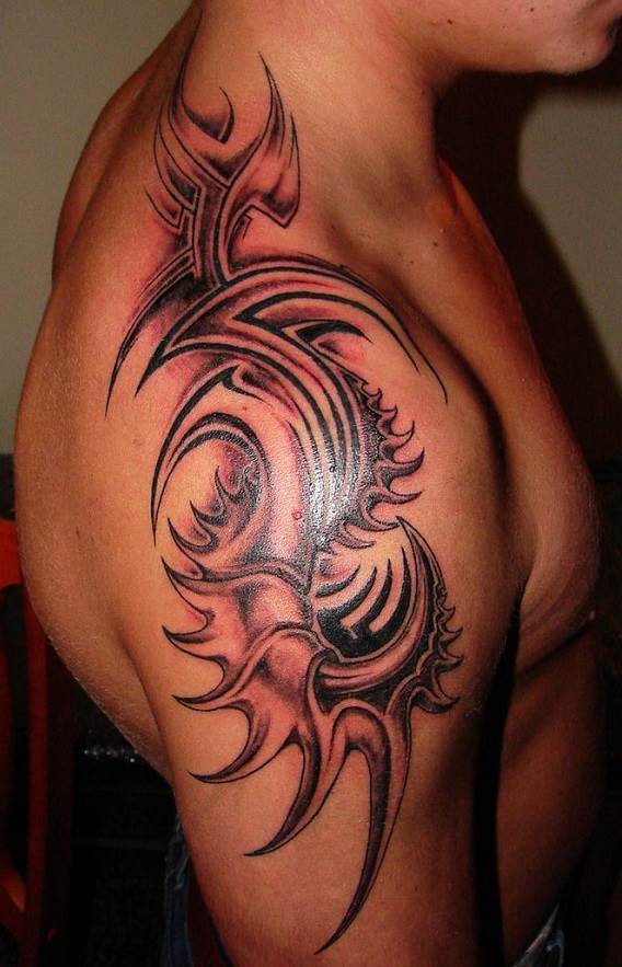 Tribal style tattoo on the shoulder for men