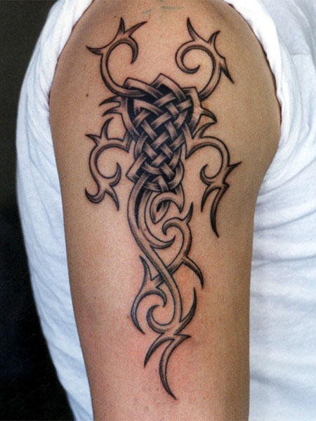 Tribal style tattoo on the shoulder for men