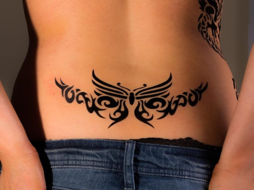 Tribal style tattoo on the back for women