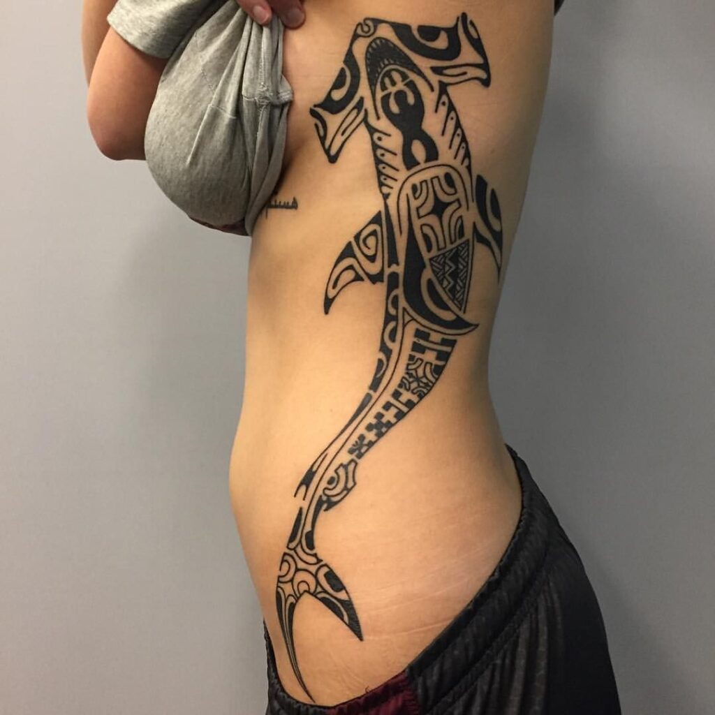 Tribal style tattoo on the side for women