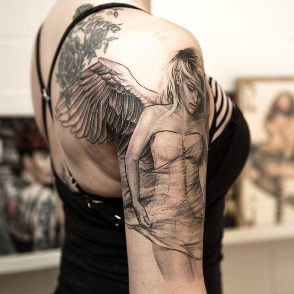 Large angel tattoo on shoulder for women