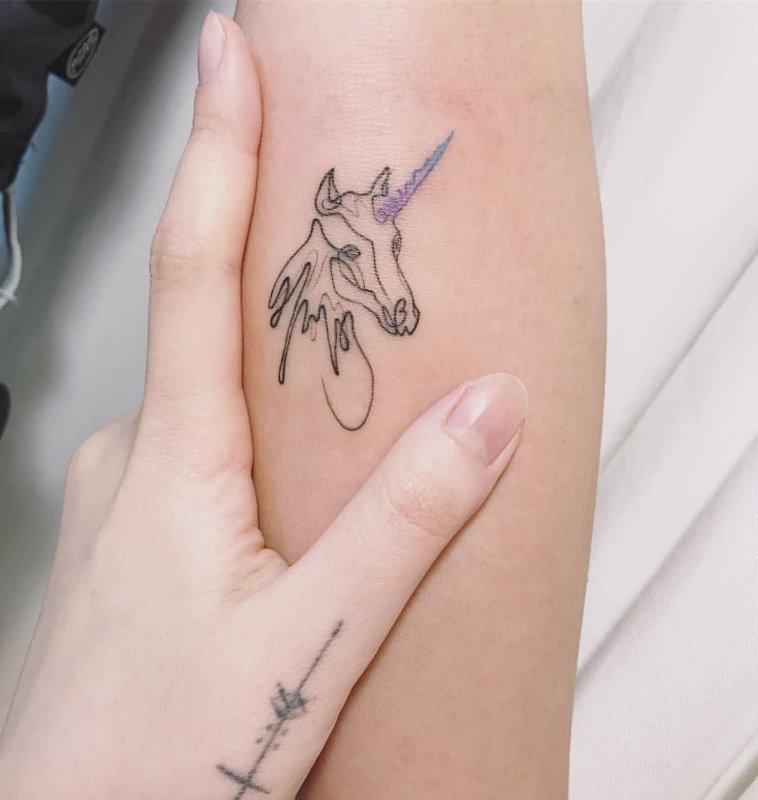 Unicorn tattoo on forearm for women