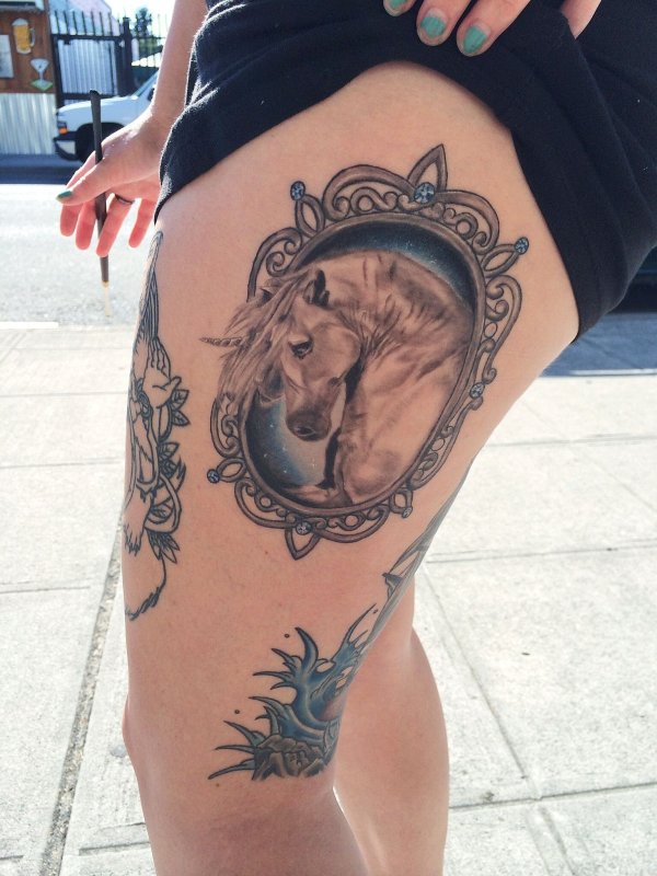 Unicorn tattoo on thigh for women