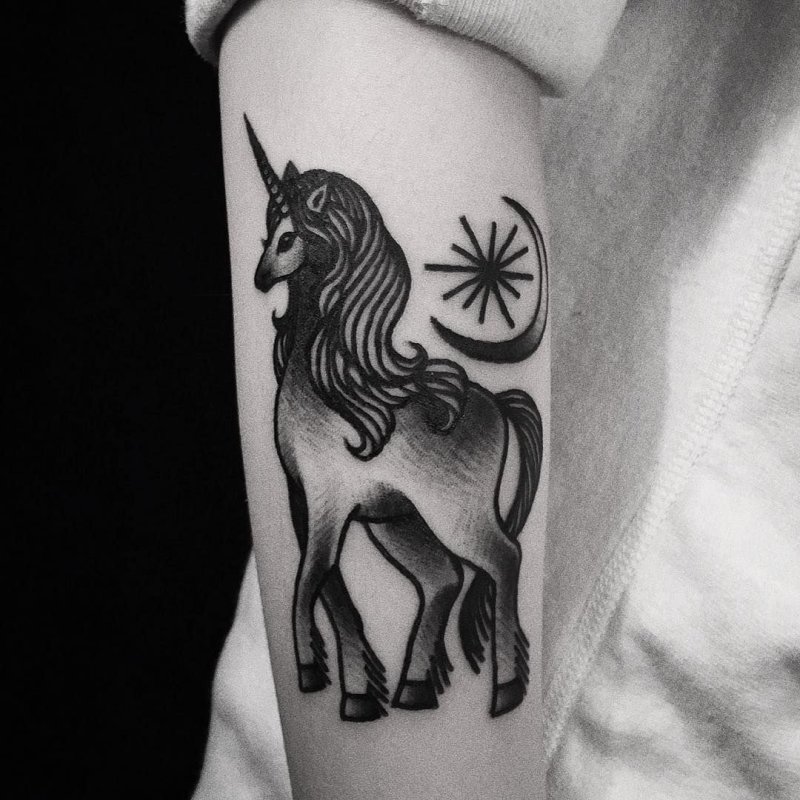 Unicorn tattoo on arm for women