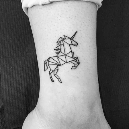 Unicorn tattoo on leg for women