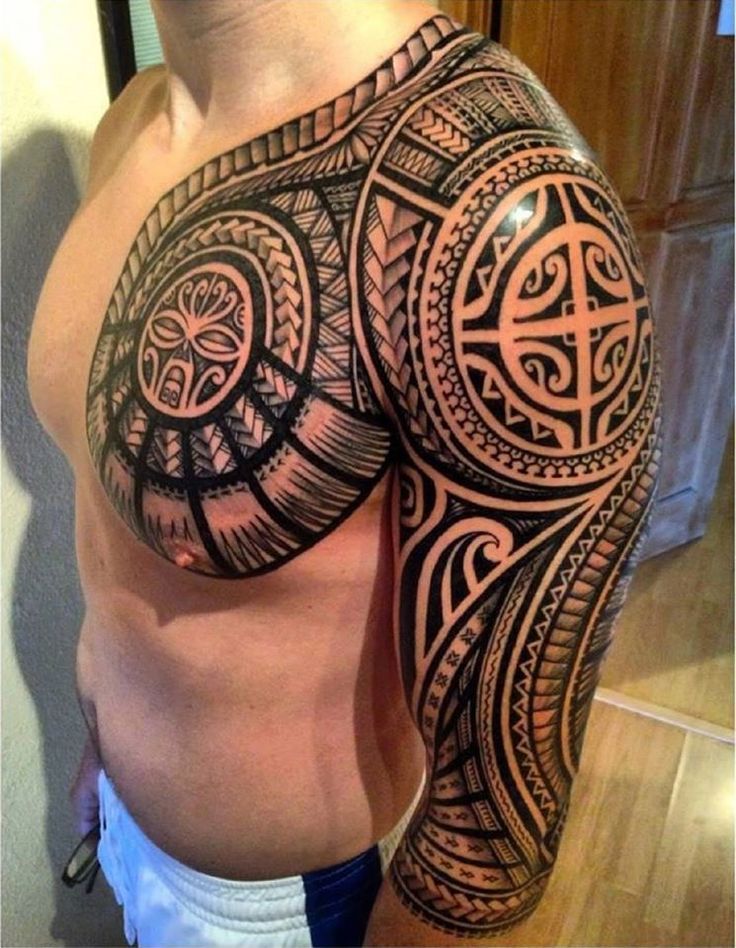 Polynesian style tattoo on the arm for men