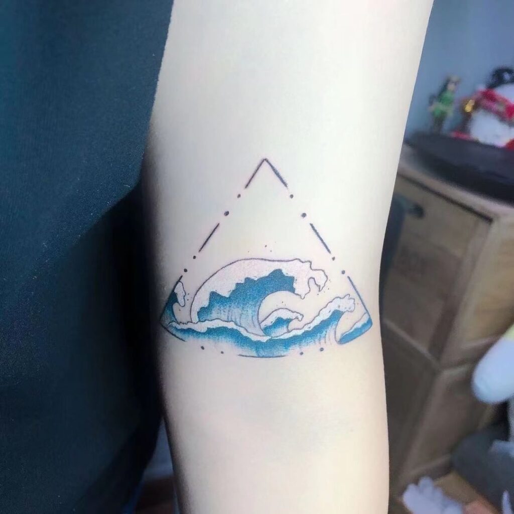 Wave tattoo on forearm for women