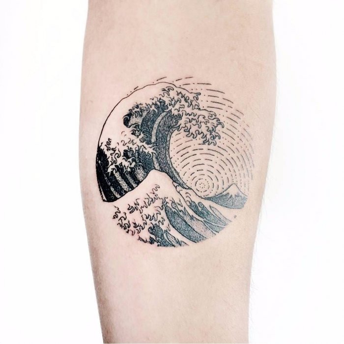 Wave tattoo on the arm for men