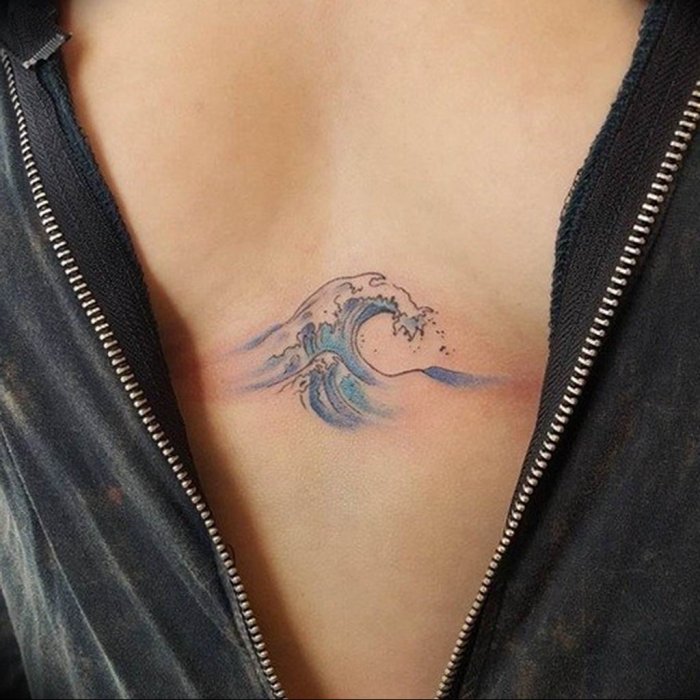 Wave tattoo on chest for women