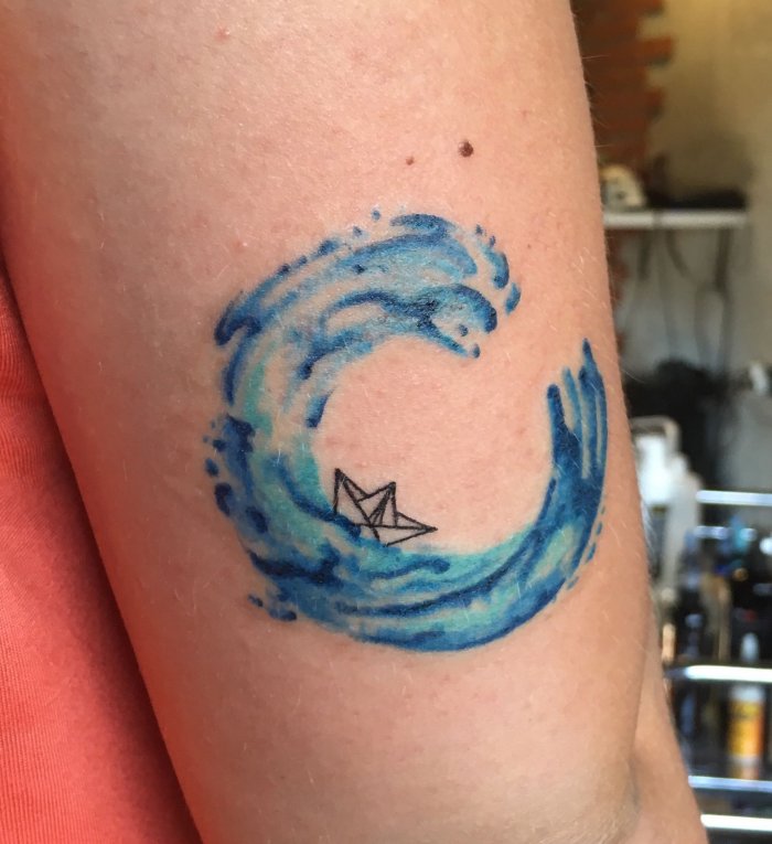 Colorful wave tattoo on shoulder for women