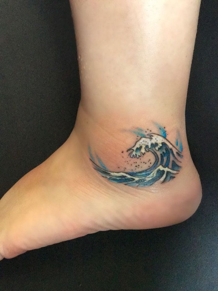 Wave tattoo on ankle for women