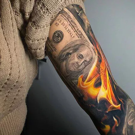 Colorful money tattoo on arm for women