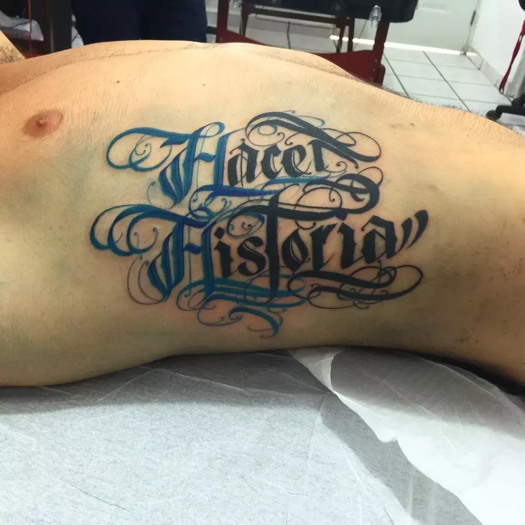 Lettering style tattoos on the side for men