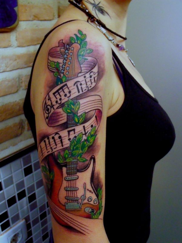 Colorful guitar tattoo on shoulder for women