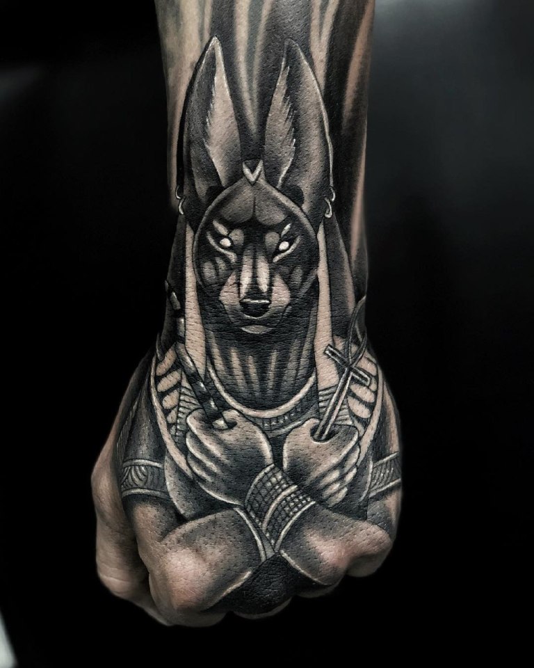 Anubis tattoo on the hand for men