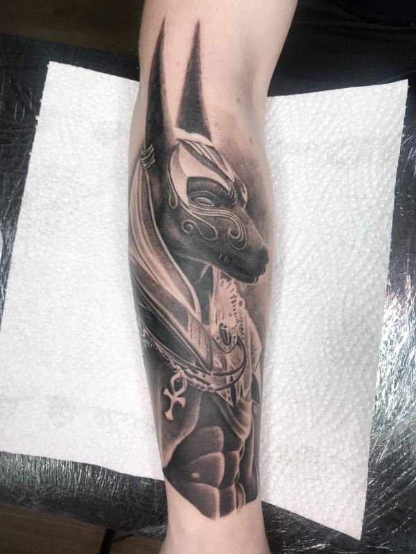 Anubis tattoo on the leg for men