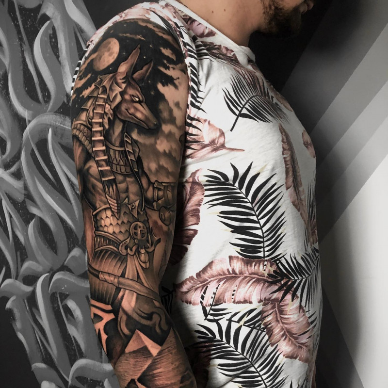 Large Anubis tattoo on the arm for men