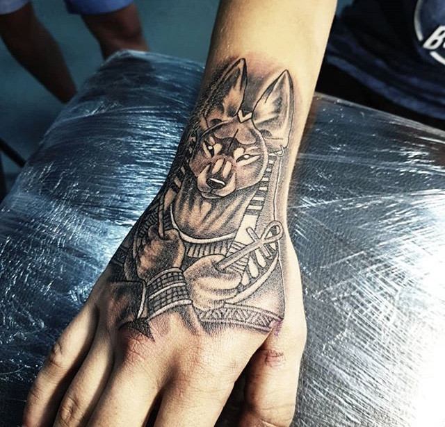 Anubis tattoo on the hand for men