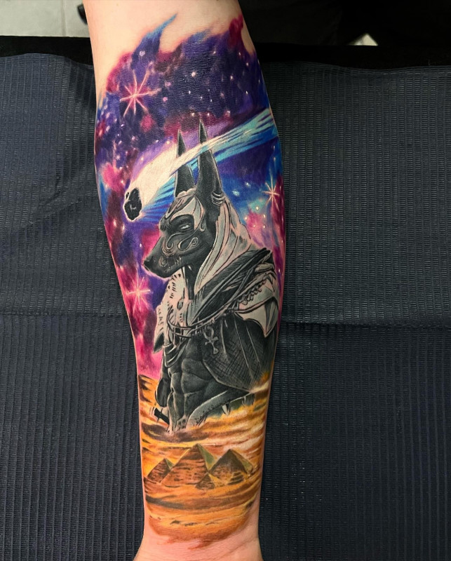 Anubis color tattoo on arm for women