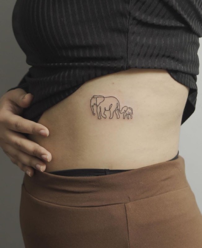 Tattoo of two elephants in minimalist style on the side for women