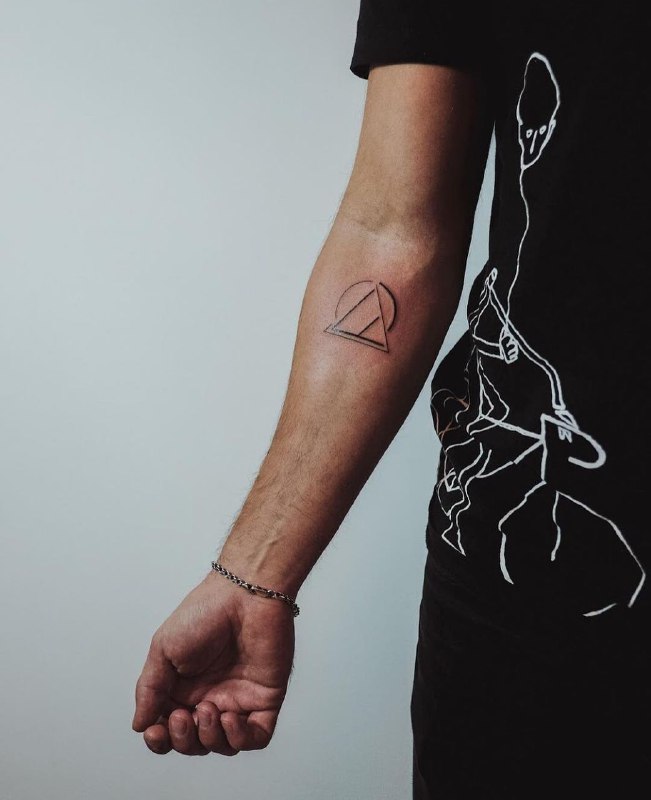 Minimalist style tattoo on the forearm for men