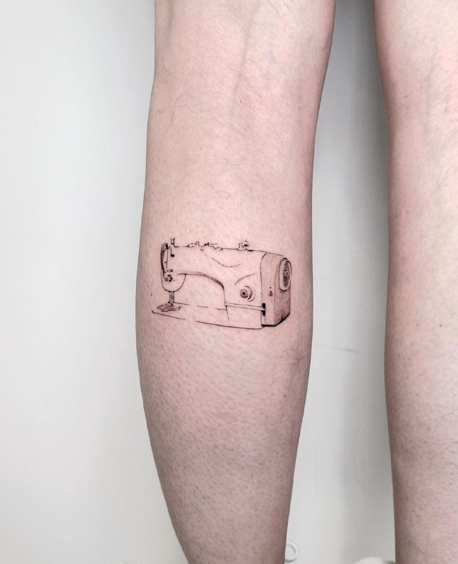 Minimalist style tattoo on the calf for women