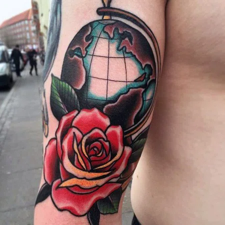 Color globe tattoo on shoulder for men