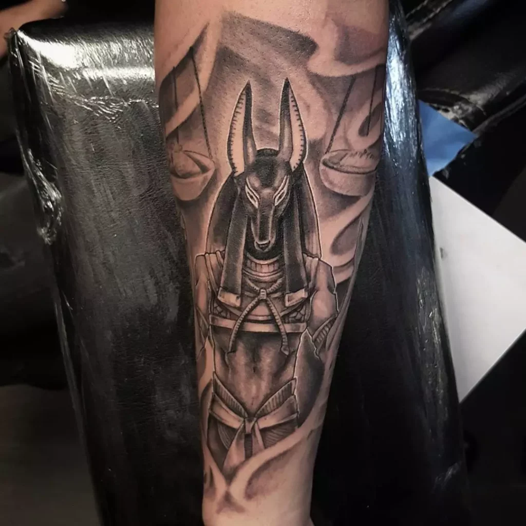 Anubis tattoo on forearm for men