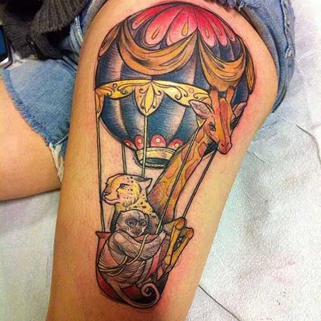 Balloon tattoo on thigh for women