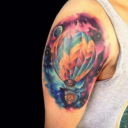 Colorful balloon tattoo on shoulder for men