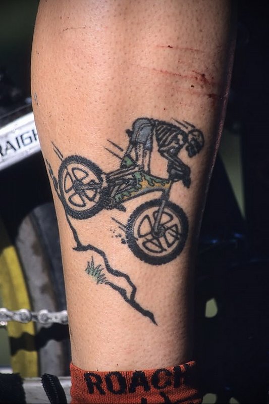 Bicycle tattoo on arm for men