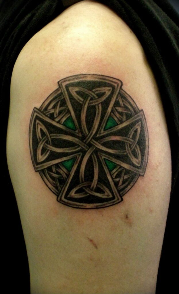 Celtic cross tattoo on shoulder for men