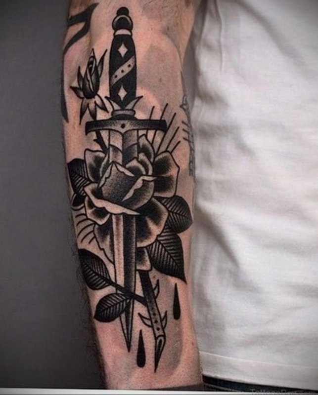 Dagger and rose tattoo on forearm for men