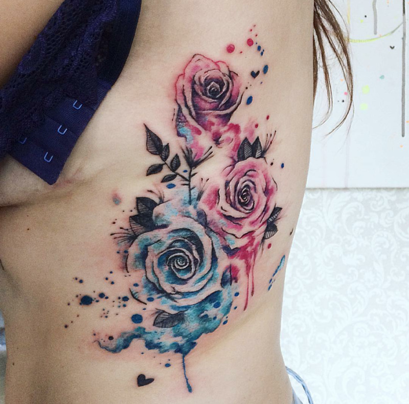 Watercolor style tattoo on the side for women