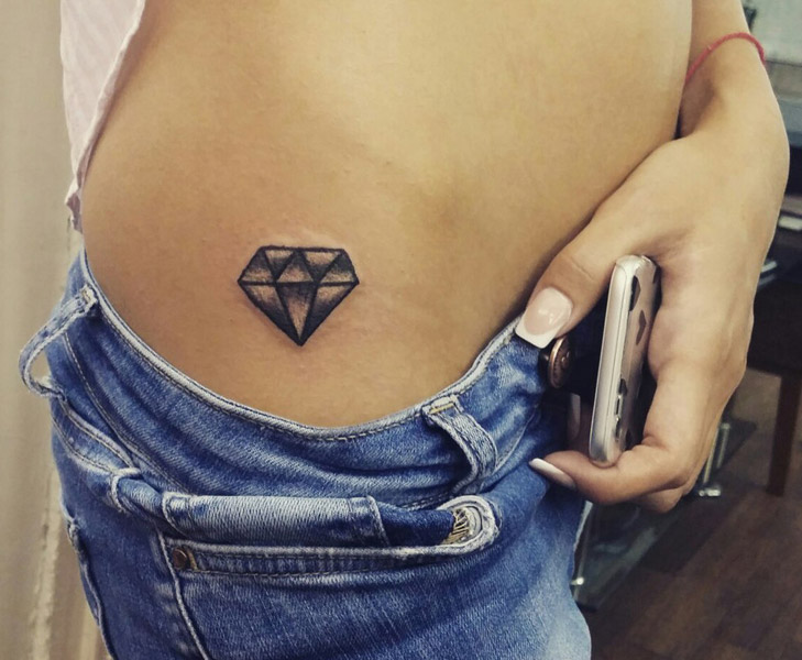 Diamond tattoo on the side for women