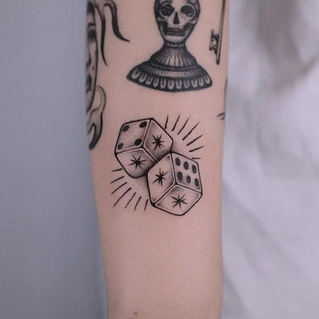 Dice tattoo on forearm for men