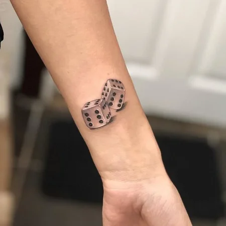 Dice tattoo on the arm for men