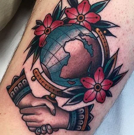 Globe tattoo on thigh for men